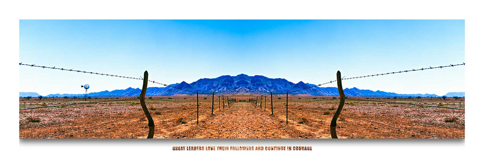 Composite image of blue mountains and fence.